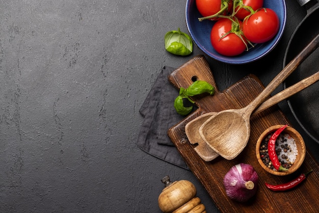 Topdown view of a kitchen table with ingredients utensils and copy space