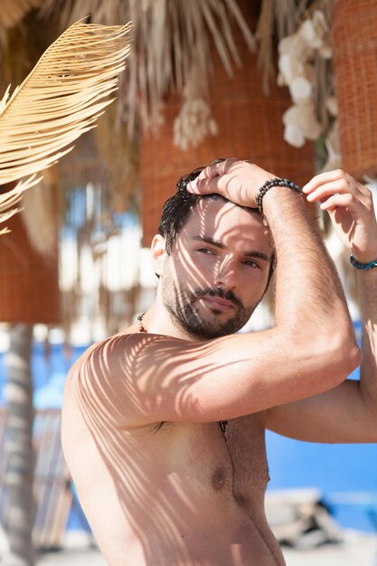 Topless handsome man outdoor portrait