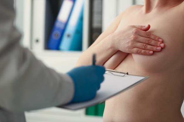 Topless patient in doctors office