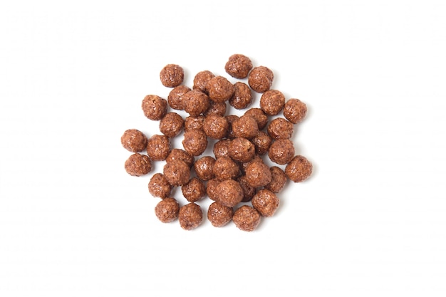 Topview of chocolate cereal balls isolated on white background.