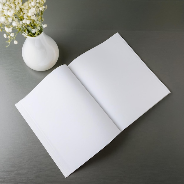 topview mockup of a blank magazine on a desk with a flower vase