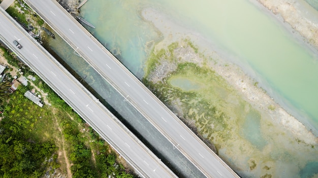 topview road street bridge pararell above the sea