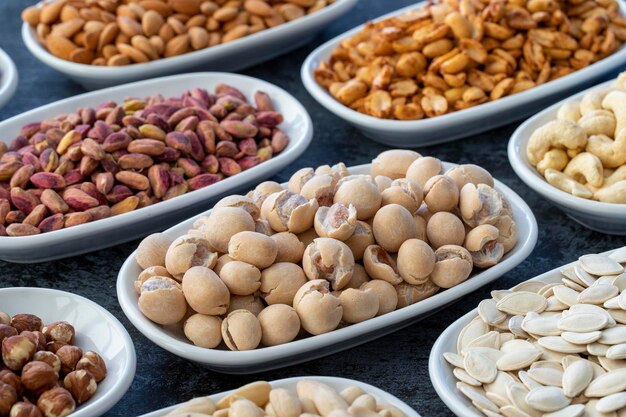 Topy fistik or peanuts in selective focus Types of nuts found in bulk on a dark background