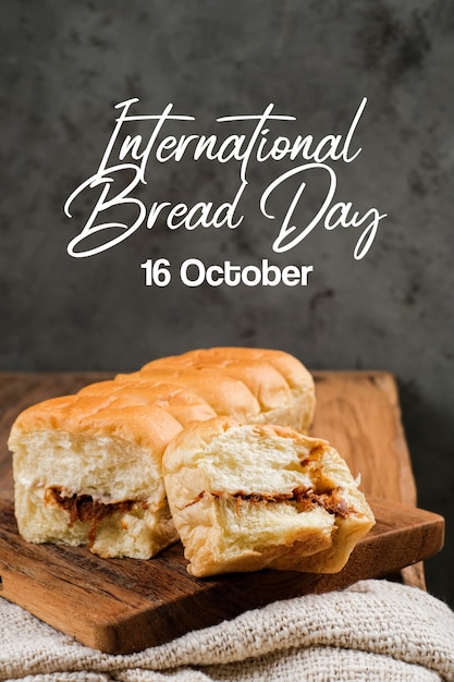 Torn bread filled with beef floss and mayonnaise on a wooden table with lettering World Food Day