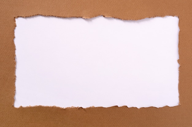 Torn brown paper oblong white background border frame