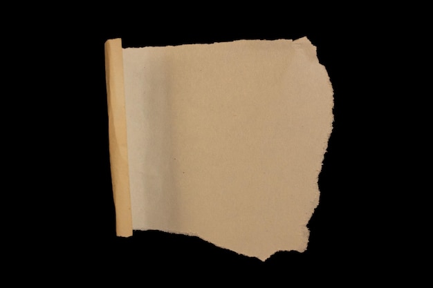 Torn brown paper with a black background