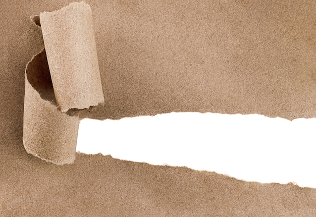 Torn brown paper with white copy space