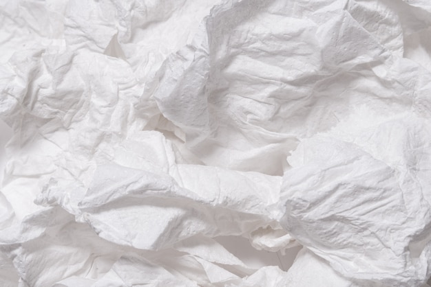 Torn crumpled white paper textured background