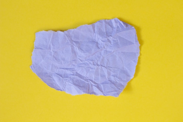 Torn paper piece isolated on yellow background