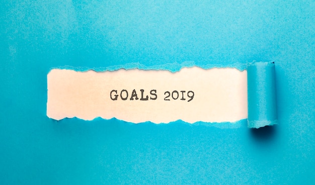 Torn paper with goals 2019 text