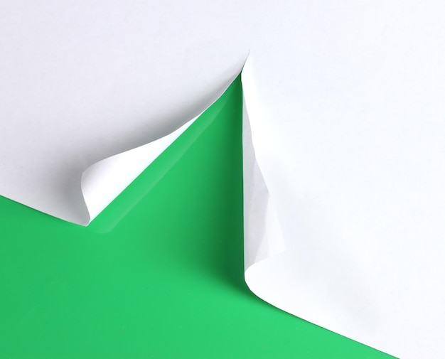 Torn paper with green background