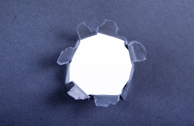 Torn paper with hole