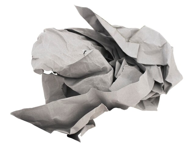 A torn piece of a sheet of gray cardboard crumpled in a nonuniform shape