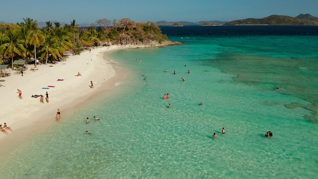 Torpical island with white sandy beach top view