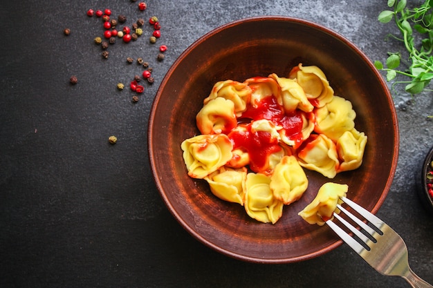 Tortellini con ripieno di ravioli