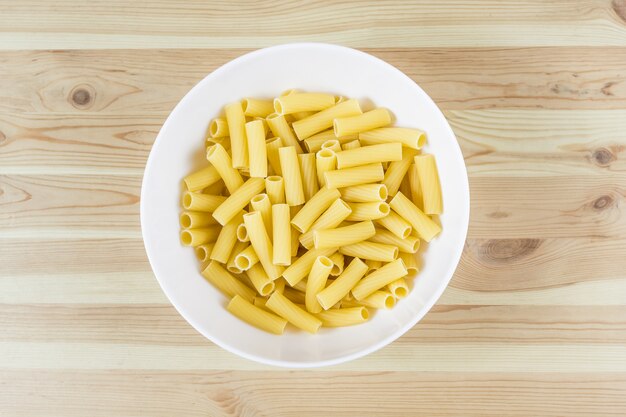 Tortiglioni pasta uncooked in bowl