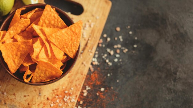 Tortilla nacho chips food background salty spicy crunchy slices in a bowl copyspace concept