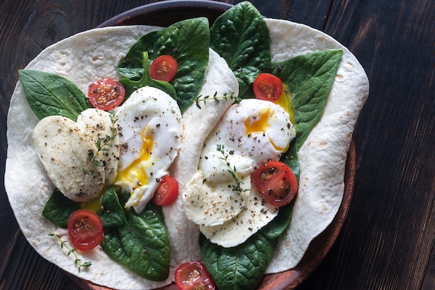 Tortilla sandwiches with poached eggs