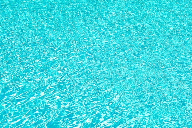 Total relaxation. swimming pool rippled water. sea water background. blue water waves. malibu beach life. underwater ocean. miami paradise resort. summer vacation. luxury hotel pool. sea background.