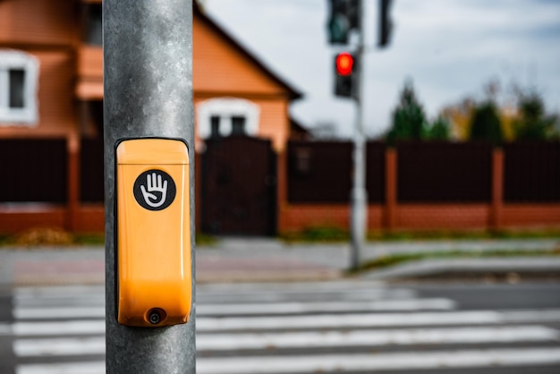 Touch button of traffic light at pedestrian crossing.