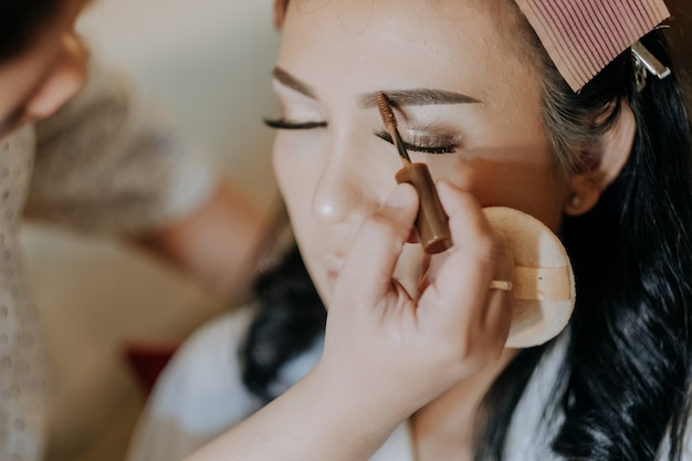 touch up asian woman microblading eyebrow