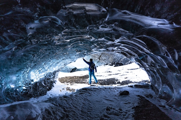 Photo touching ice in an ice cave