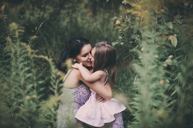 Photo touching portrait of a mother and daughter