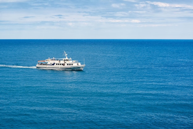 A tourist boat floats in the sea