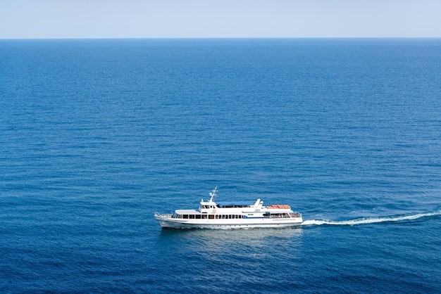 A tourist boat floats in the sea