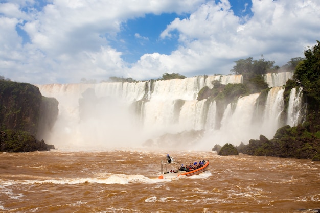 Tourist boat at Iguazu falls cascades at Argentina