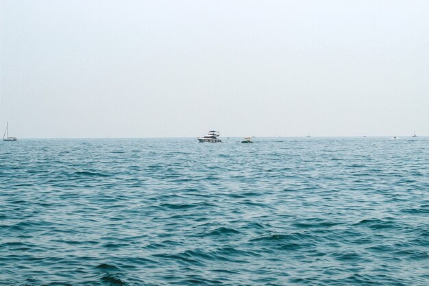 Tourist boat sailing here on the blue sea.