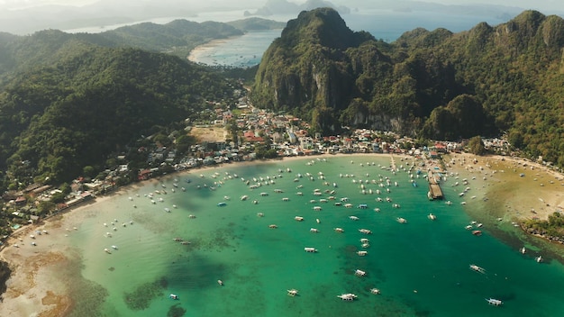 Tourist boats in a bay with blue water