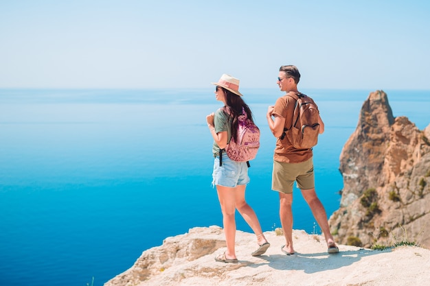 Tourist couple hiking on the summer vacation