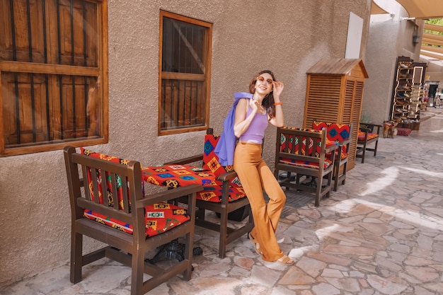 Tourist girl in authentic cafe in Al Fahidi district in Dubai