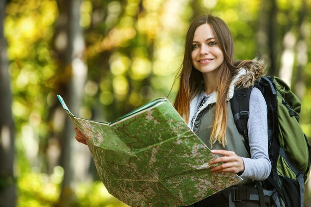 Tourist Girl Forest map backpack sun