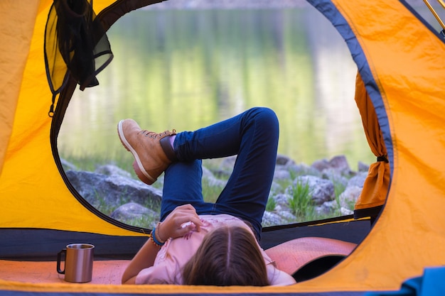 Tourist girl lying in a tent, norway