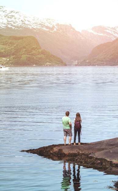 Tourist girl and man at the Hardangerfjorden