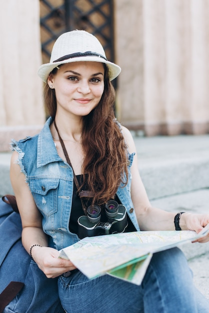 A tourist girl with a map