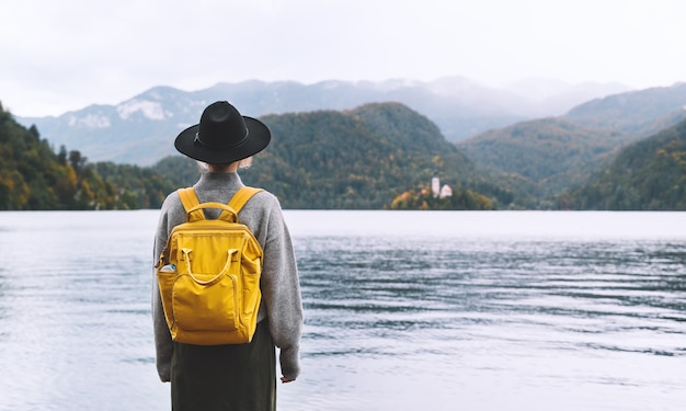 Tourist looking at amazing beautiful Lake Bled and Church on the Island Travel in Slovenia Europe