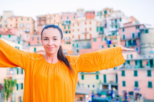 Tourist looking at scenic view of manarola, cinque terre, liguria, italy