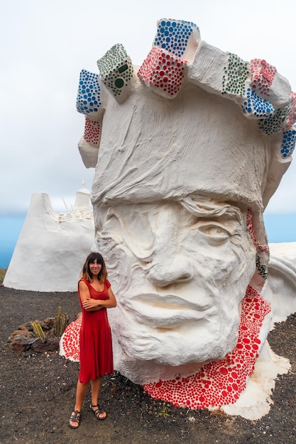 A tourist in the lovely white sculpture of Valverde village on the island of El Hierro Canary Islands Spain