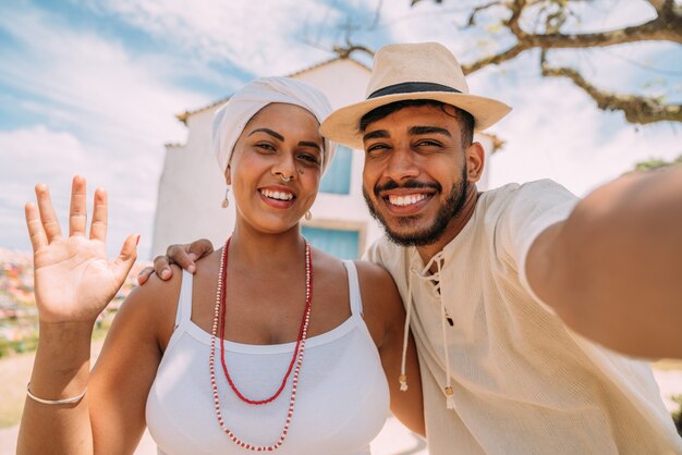 Tourist making a selfie with a Bahian woman