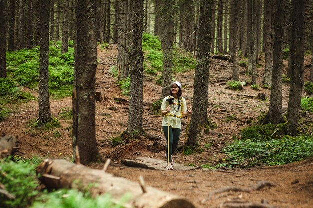 Tourist in the mountains among the trees