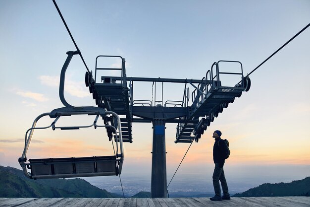 Tourist near cable car in the mountains