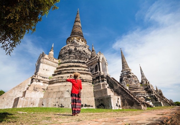 Tourist near old temple in Thailand