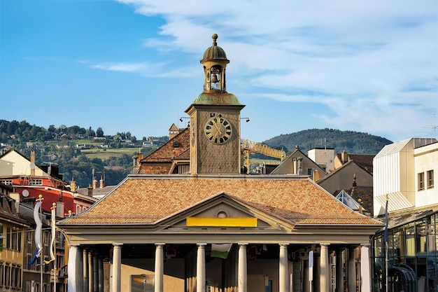 Tourist office building with clock tower on Grande Place Square in Vevey, Vaud canton, Switzerland