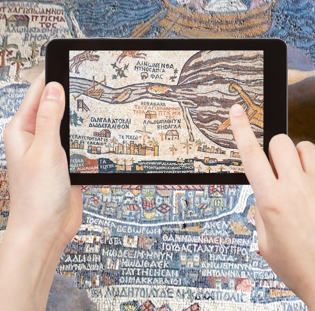 Tourist photographs of ancient Holy Land map