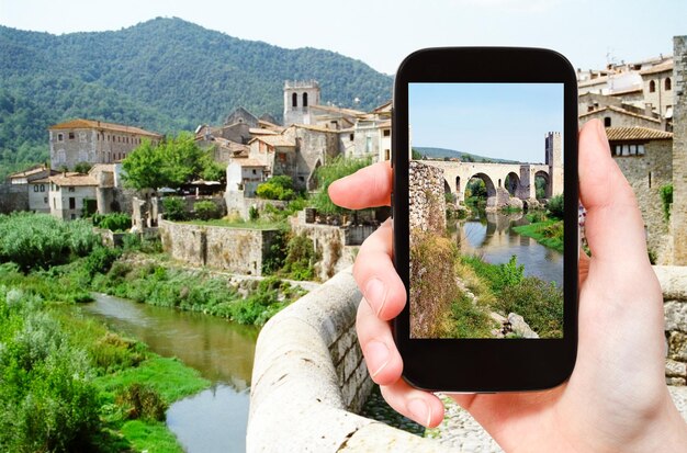 Tourist photographs of bridge in Besalu town