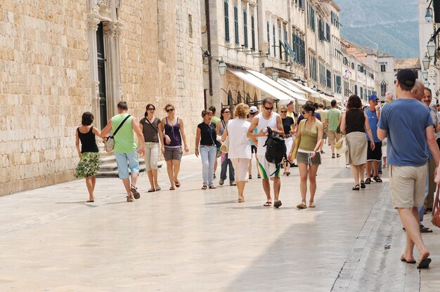 Tourist relax and have fun at dubrovnik on adreatic sea at summer vacation