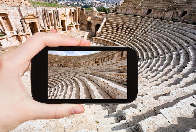 Tourist taking photo of arena Large South Theatre